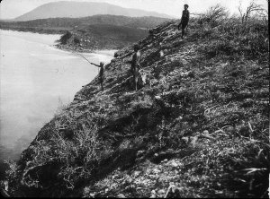 Three Aboriginal men on cliff top - Port Macquarie area...