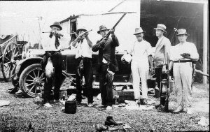 Shooting Party, note birds hanging from waist
