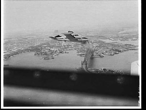 CSIRO Cessna rainmaking aircraft over Sydney Harbour Br...