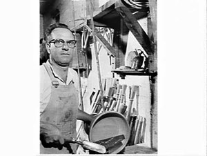 Albert Wiggins in his carpenter's workshop with teak sa...