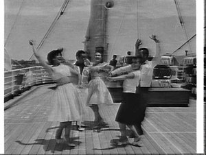 Spanish dancers en route to New Zealand on the deck of ...