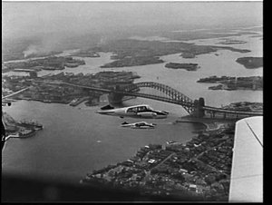 CSIRO Cessna rainmaking aircraft over Sydney Harbour Br...