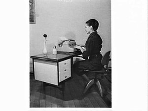 Model posing as a secretary typist with an IBM electric...