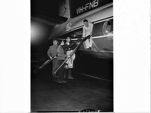 Skiers boarding an Airlines of NSW Fokker Friendship Ro...