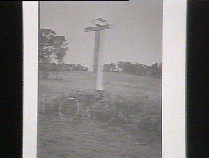 (MM). Bicycle at Macquarie Pass Road signpost