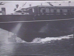 Close-up of stern entering water at launching