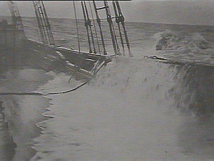 Storm breaking on deck of schooner Holmwood