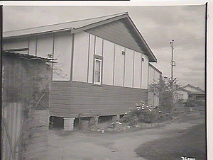 Blacktown District, side view of house showing flowerbe...