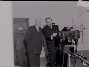 Premier J.J. Cahill examining X-ray apparatus at X-Ray ...