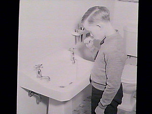 Boy cleaning his teeth