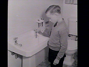 Boy cleaning his teeth