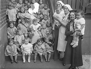 Crowd of babies and three nurses