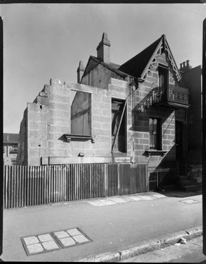 File 04: Half demolished house, Bourke St, 1953 / photo...