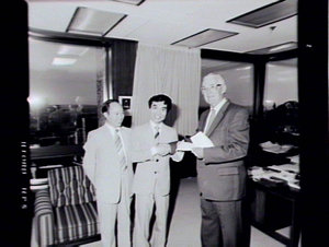 Minister (Mr Peter Cox) presenting cheque to Sydney Uni...