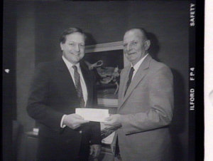 Minister presents cheque to Mr F. Miller, M.P.