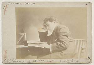 Gaston Mervale [in a suit, seated at a desk] / The Falk...