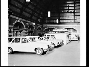 Cars parked on the platforms and concourse during a bus...