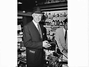 John McCallum, producer of My fair lady, shops in the d...