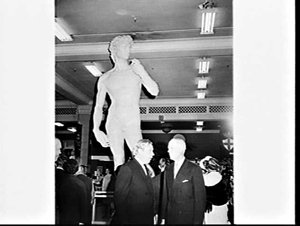 Charles Lloyd Jones in front of replica statue of Miche...