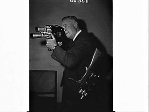 Unidentified cinematographer with two motion picture ca...