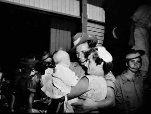 Army disembarks at East Circular Quay and greets family...
