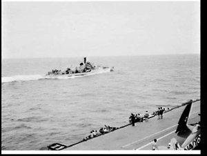 HMAS Tobruk passes HMAS Sydney at full speed during Roy...