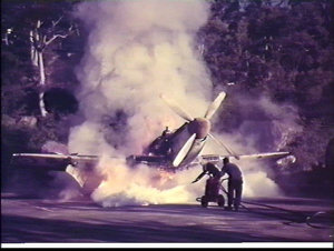 Extinguishing a fire in a Fairey Firefly aeroplane for ...