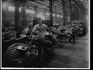 Workmen and trailer axles assembly line at Freighter Tr...