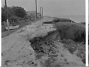 Storm damage washes away road and waterfront, Brighton-...