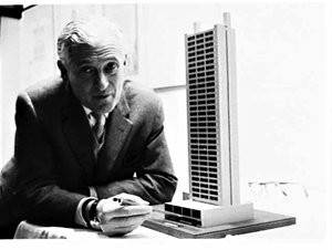 Dr. [Henry] Epstein with an architectural model of a bl...