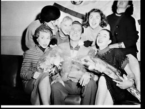 American singer Johnnie Ray with female fans, Mascot