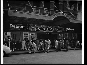 Exterior of Palace Theatre with queues for the film Cur...