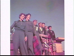 Women members of the Australian Team with rugs to watch...