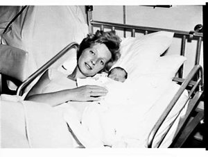 Mrs. Searle and her newborn baby on the liner Fairsky, ...