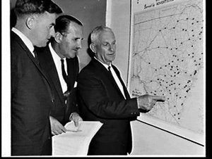 Country Press Association executives look at a map of c...