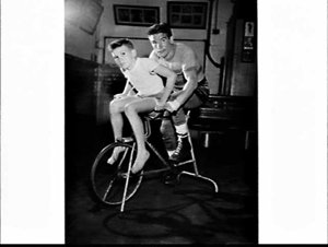 Belgian boxer Johanson on an exercise bike, McQuillan's...