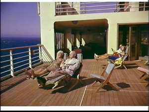 Passengers in deck chairs on the P&O liner Oriana at se...