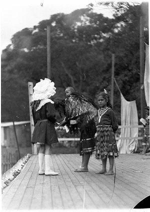 Maori mother and children with girl in European dress, ...