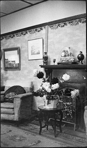 Fireplace and living room in house shown in the Perier ...