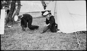 Cadets at Navy League camp dressing in sailor uniforms,...