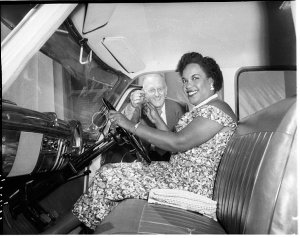 Winifred Atwell at the wheel of her new Ford Customline