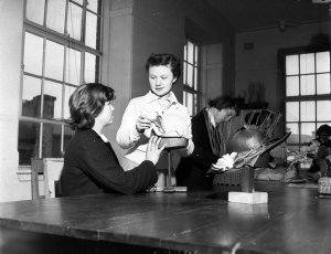 Ruth Elliott teaching millinery to deaf girls at the Sc...