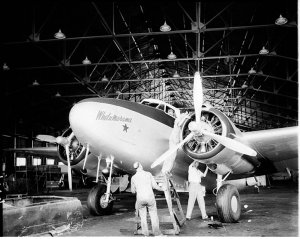 Technicians check the Lockheed Lodestar refit for Field...