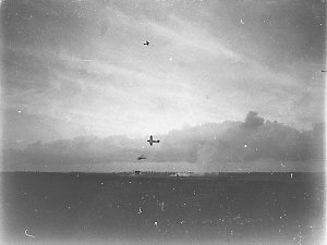 Two aircraft strafing an Army tank