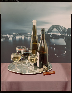 File 19: Wine bottles, glasses, etc with bridge backgro...