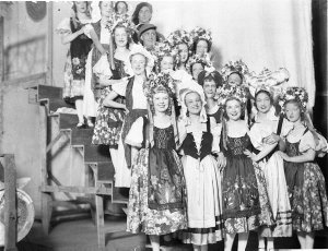 Group of vaudeville or musical artists in back-stage ta...