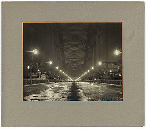 View of Sydney Harbour Bridge at night, showing steam l...