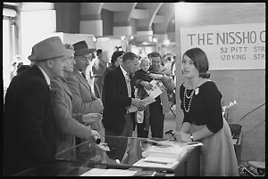 University student working at Trade Fair, 3 August 1961...