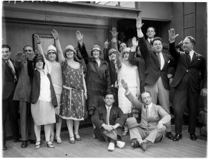 Arrival of Gonsalez Opera Company with hands raised in ...