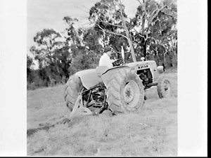 Fiat tractor ploughing a paddock on a farm